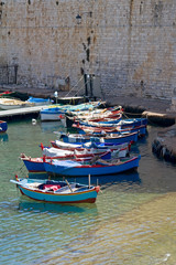 Boats moored in Giovinazzo port. Apulia.