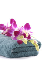 Obraz na płótnie Canvas pink gladiola orchid on blue towel