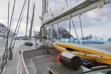 Tuinposter Sailing boat in Antarctic waters with majestic landscape © Achim Baqué