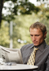 Fototapeta premium businessman reading newspaper