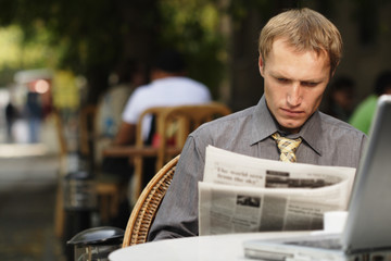 businessman reading newspaper