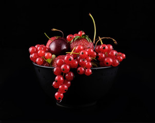 fresh red  fruit on black background