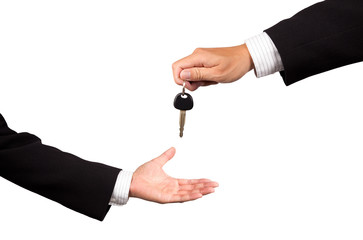 businessman receiving car key from salesman