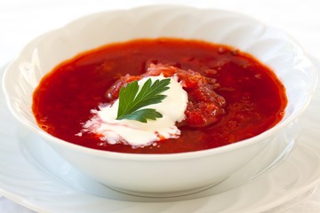 Russian beetroot soup Borsch with sour cream and parsley