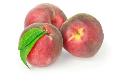 Three peaches isolated on white