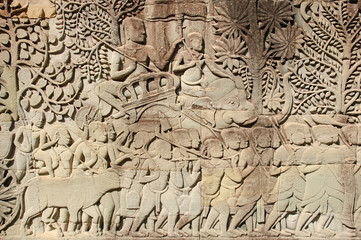 Carving stone wall at Angkor Thom.
