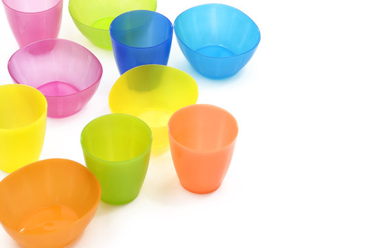 Colorful plastic cups and dish
