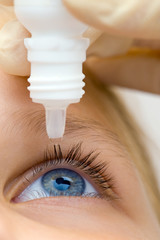 Oculist applying pipette for patients