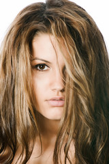 Naklejka premium Portrait of beauty young girl with closed one eye by curl