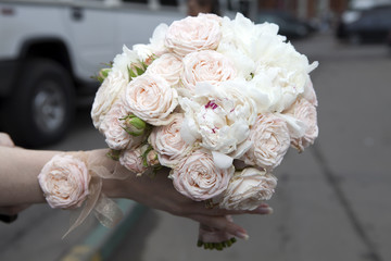Wedding bouquet of pink roses and peony