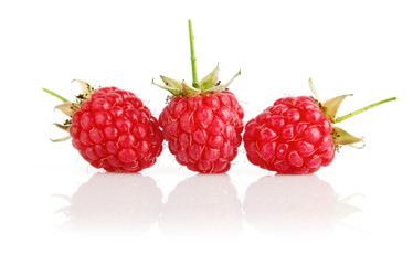 fresh raspberry fruits with green leaves