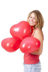 Junge Frau mit Luftbaloonherzen