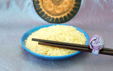 Plate with rice and chopsticks