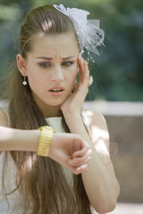 worried bride looking at watch