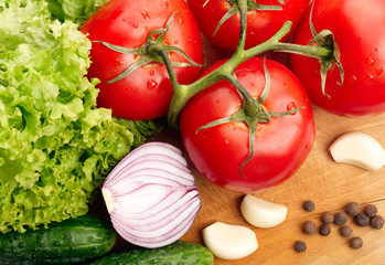 Fresh vegetables on wooden hardboard