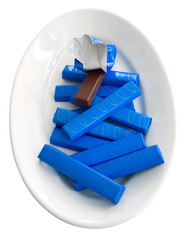 Chocolate bars on white dish.