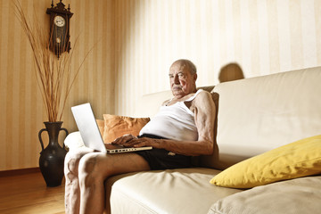 elder man with laptop