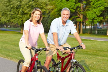Fototapeta na wymiar seniors couple biking
