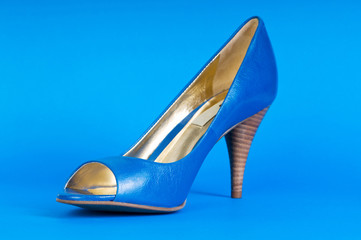 Fashion concept with blue woman shoes on high heels