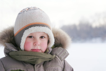 cute boy in snowsuit