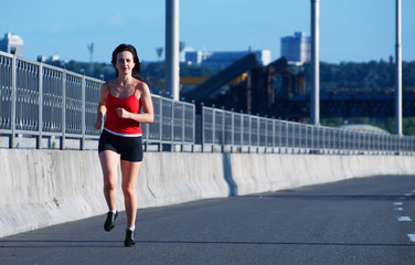 Fototapeta na wymiar Woman jogging at the highway