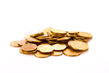A lot of coins isolated on white