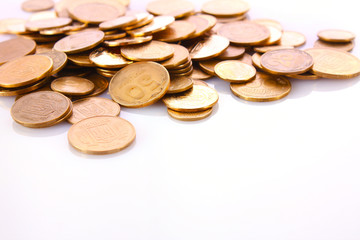 A lot of coins isolated on white