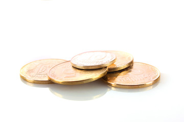 A lot of coins isolated on white