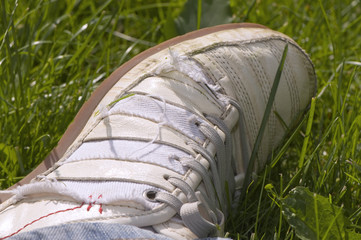 white sneaker on grass