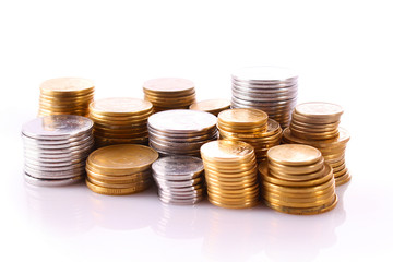 Many coins in column isolated on white