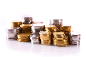 Many coins in column isolated on white