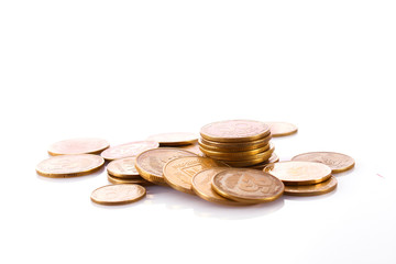 Many coins isolated on white