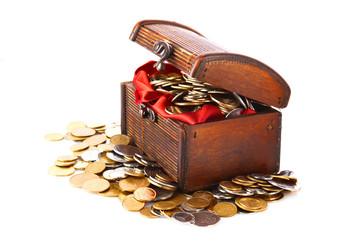 Coins in chest isolated on white