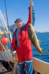 Fisherman with big fish and the spinning