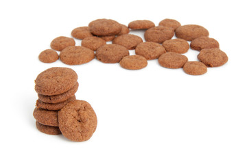 Home baked pepernoten cookies over white background