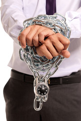 Businessman hands fettered chain and padlock, job slave symbol