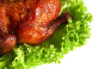 homemade hot smoked  quarter chicken on leaf lettuce bed