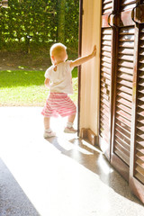 toddler standing in doors
