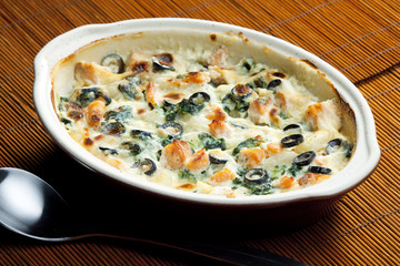 baked gnocchi with salmon, spinach and black olivves
