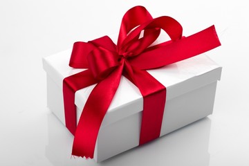 Gift decorated with a tape and a bow