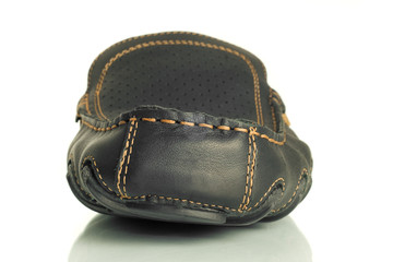 Close-up of single black mens moccasin