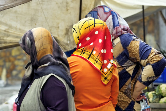 Turkish women in a market wearing headscarfs