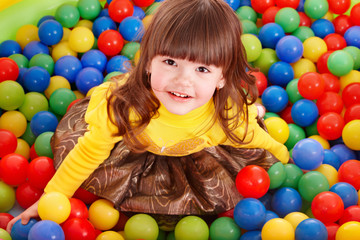 Fototapeta na wymiar Child in group colourful ball.