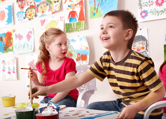 Children painting in art class.