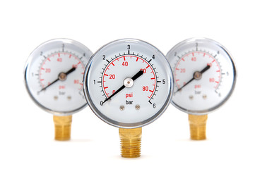 Three measuring devices on a white background