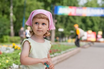 A little girl looked away, smiling, close-up