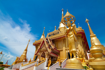 Golden Buddha in front of temple