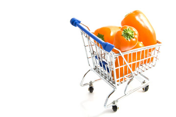 Orange paprika's in shopping trolley