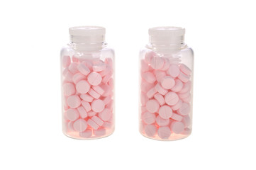 pills in bottles on a white background
