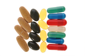 different pills on a white background